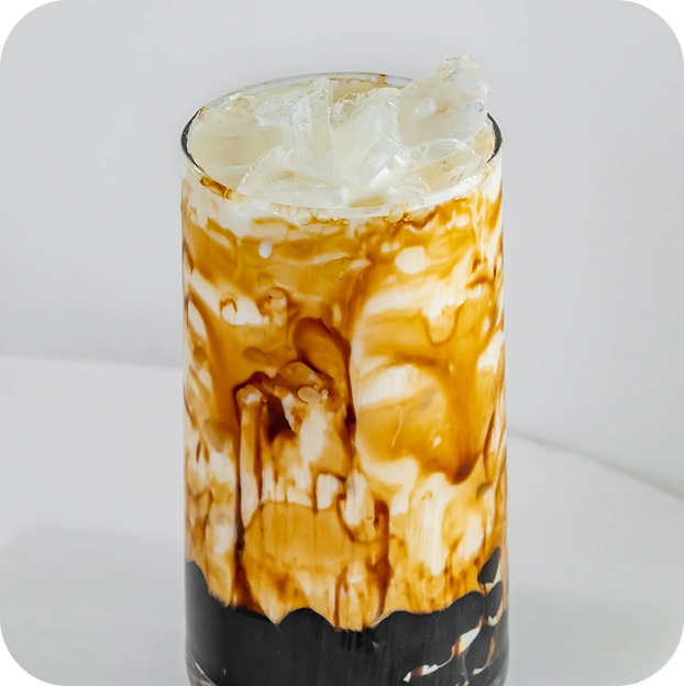 Boba tea with caramel drizzle and tapioca pearls